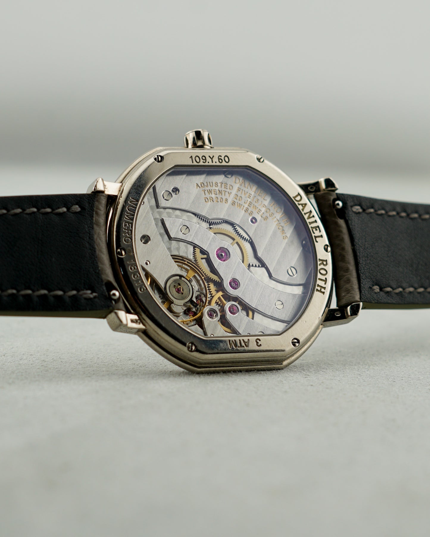 Daniel Roth watch with open case back showing its mechanical movement.