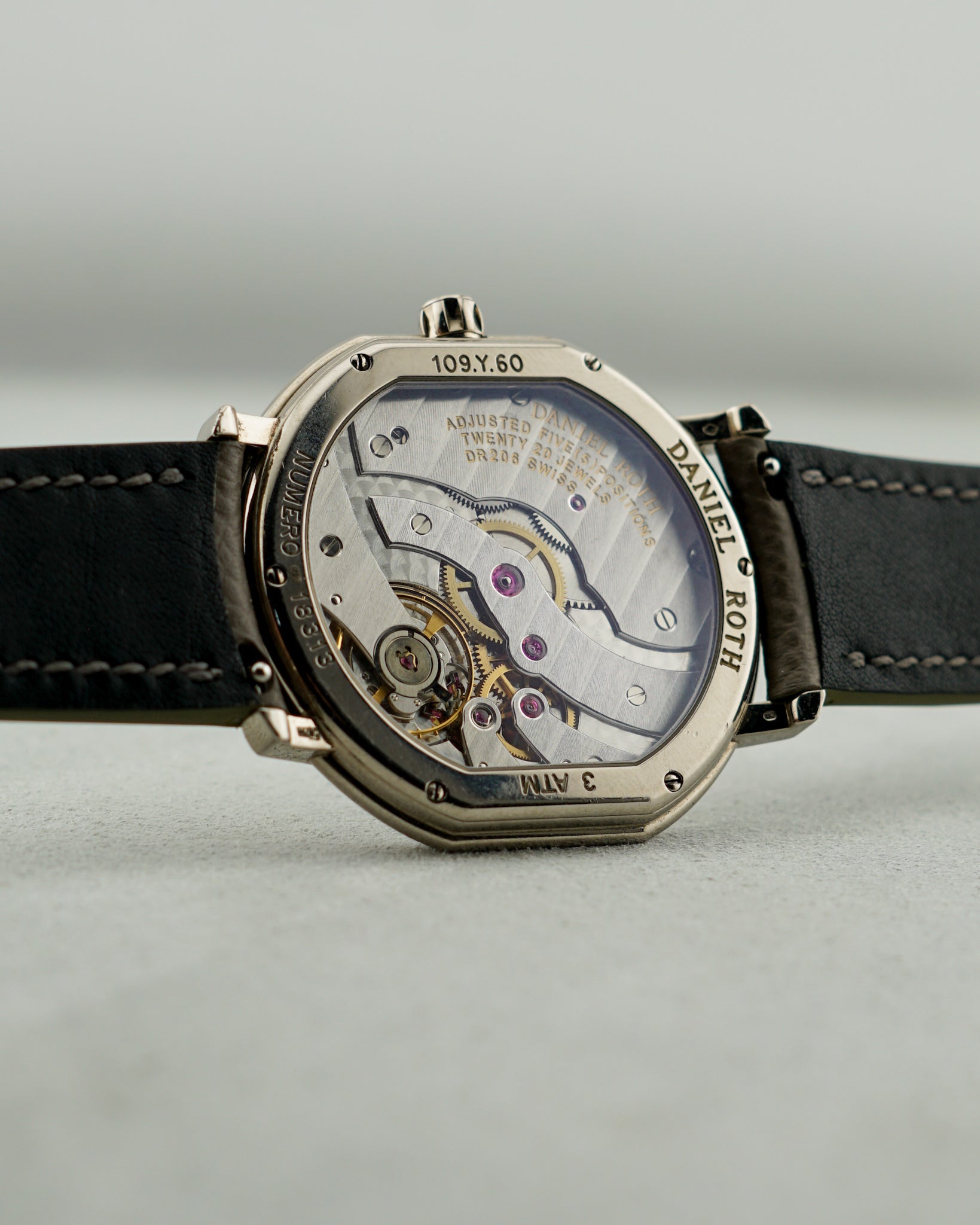 Daniel Roth watch with open case back showing its mechanical movement.